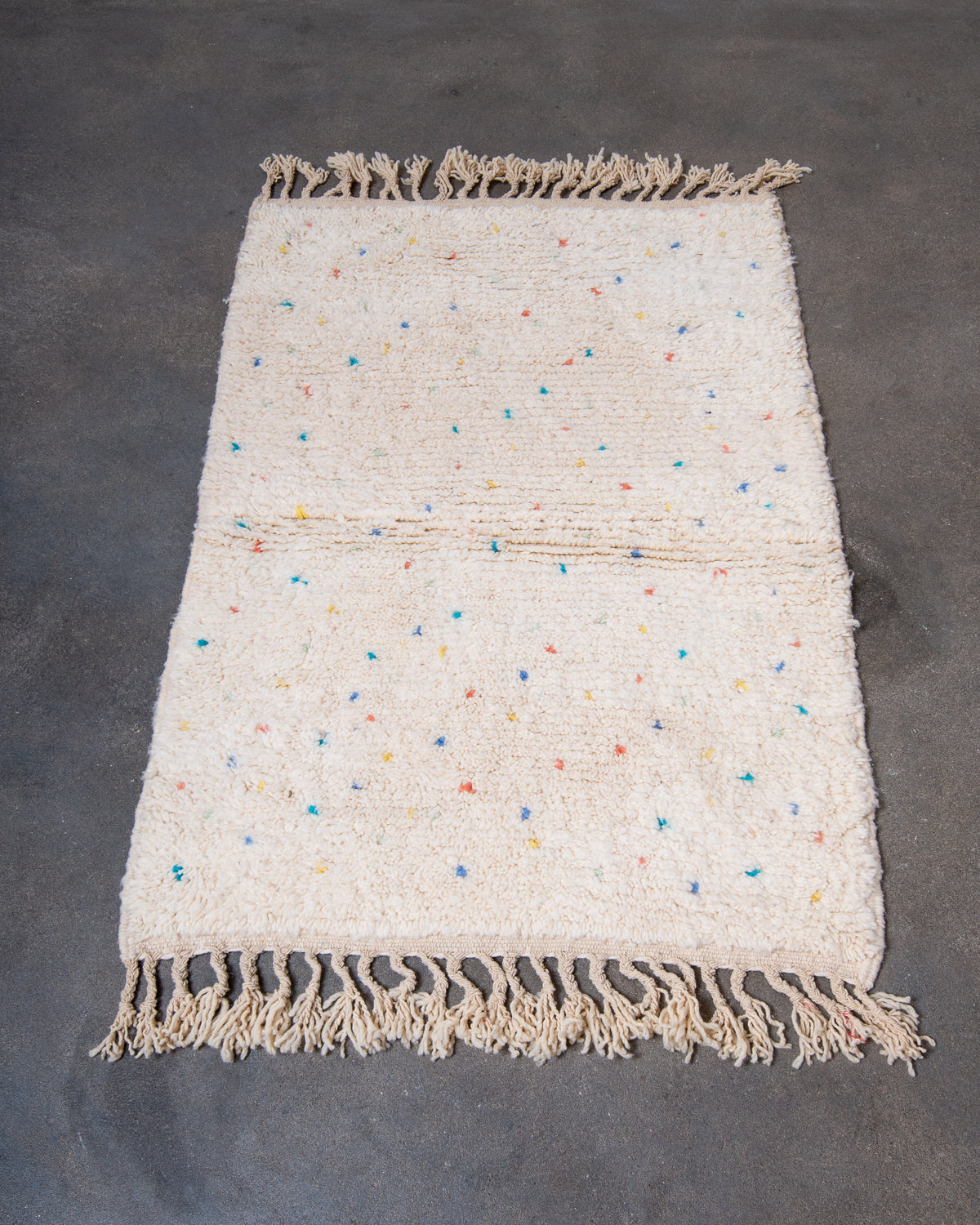 Modern, designer, handcrafted Berber rug from Morocco. Beniourain carpet with beautiful colours and patterns and fluffy wool texture.